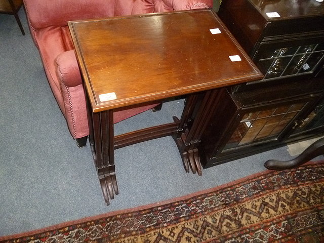 Appraisal: A NEST OF THREE MAHOGANY OCCASIONAL TABLES with spider legs