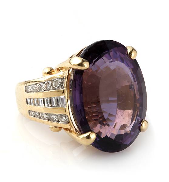 Appraisal: An amethyst diamond and k gold ring centering an oval