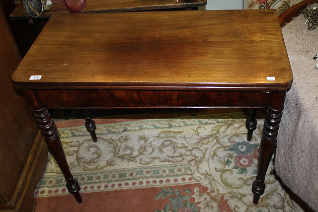 Appraisal: A TH CENTURY MAHOGANY RECTANGULAR FOLD-OVER TEA TABLE on turned