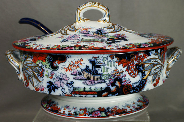 Appraisal: Polychrome ironstone tureen with lid and associated ladle oriental design