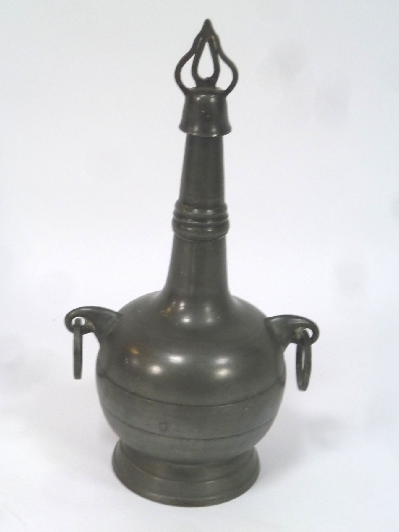 Appraisal: A pewter bottle of globe and shaft form the screw