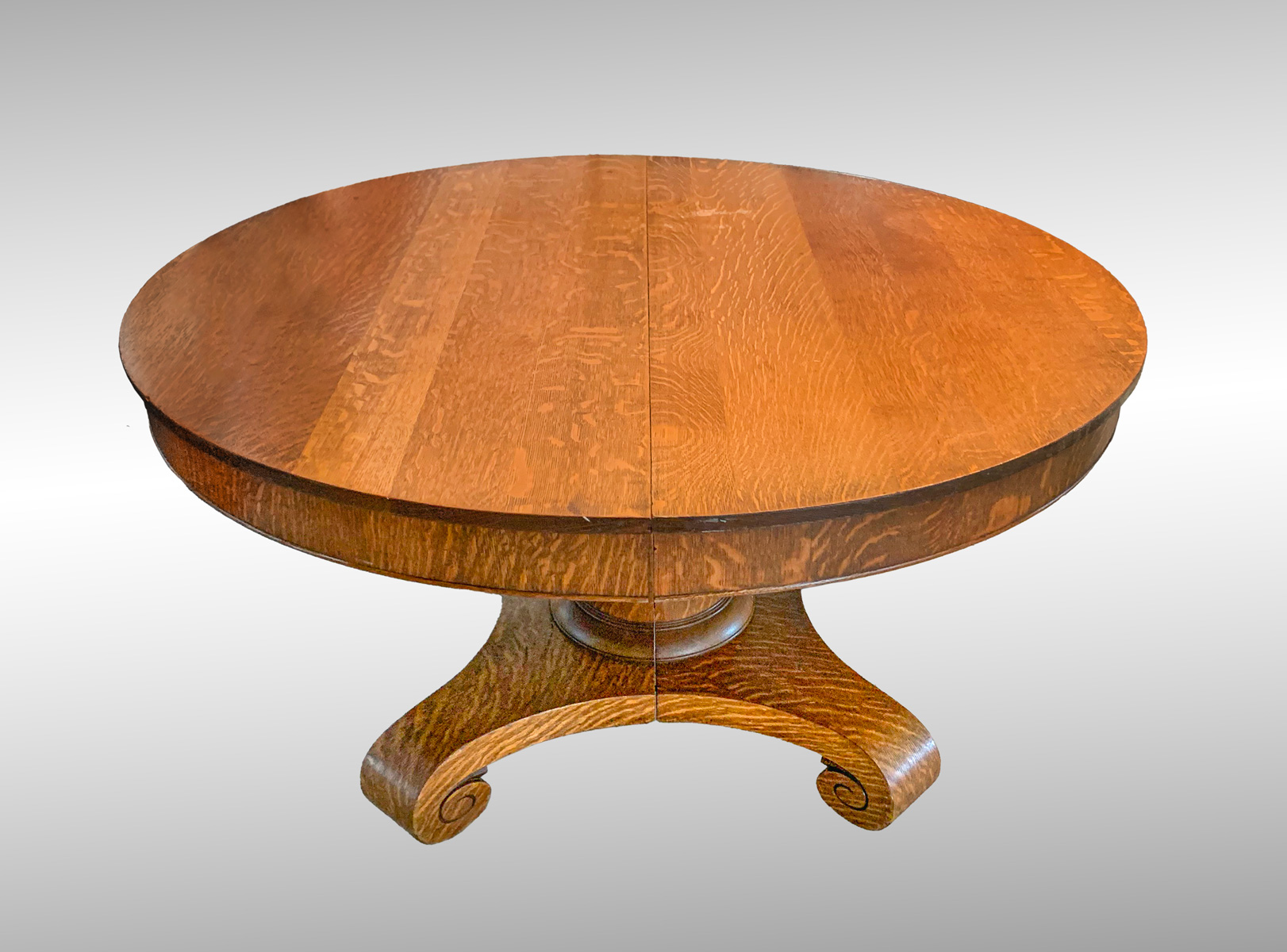 Appraisal: QUARTER SAWN OAK TABLE WITH LEAF Round Oak dining table