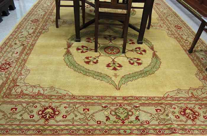 Appraisal: HAND KNOTTED ORIENTAL CARPET Pakistani Zeigler featuring twin floral medallions