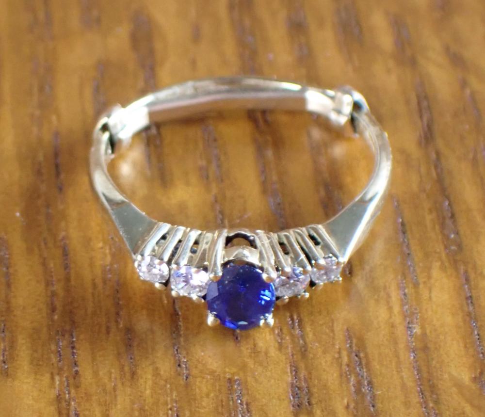 Appraisal: SAPPHIRE DIAMOND AND FOURTEEN KARAT GOLD RING with a pair