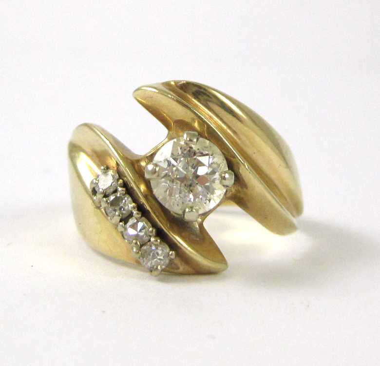 Appraisal: DIAMOND AND FOURTEEN KARAT GOLD RING with four round-cut diamonds