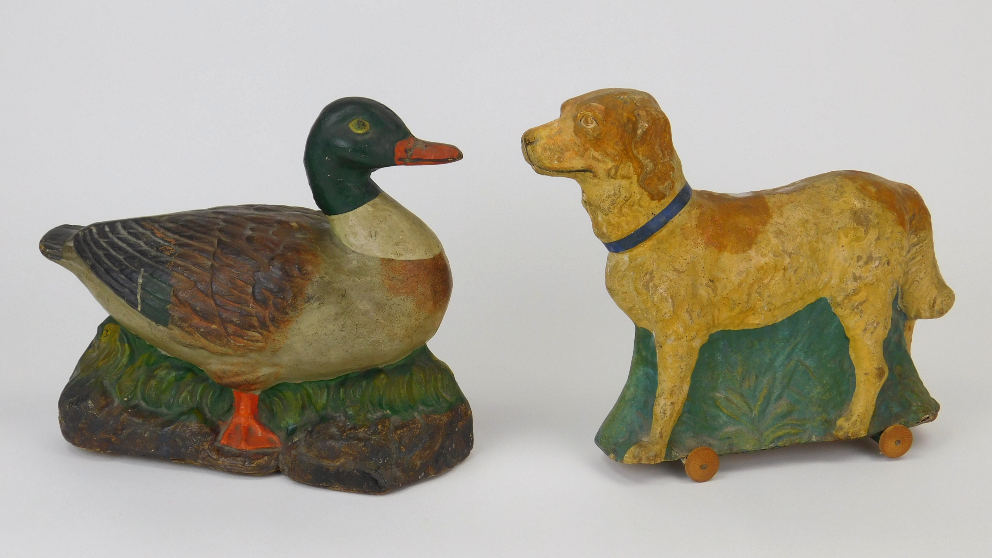 Appraisal: Vintage paper mache pull toys a dog and a duck