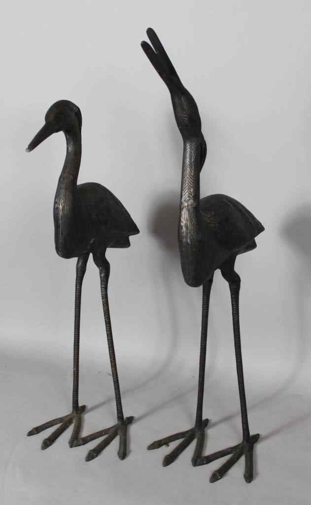 Appraisal: PAIR OF JAPANESE PATINATED BRONZE MODELS OF CRANES each bird