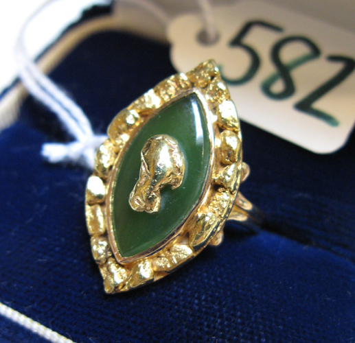 Appraisal: GREEN JADE AND TEN KARAT GOLD RING set with a