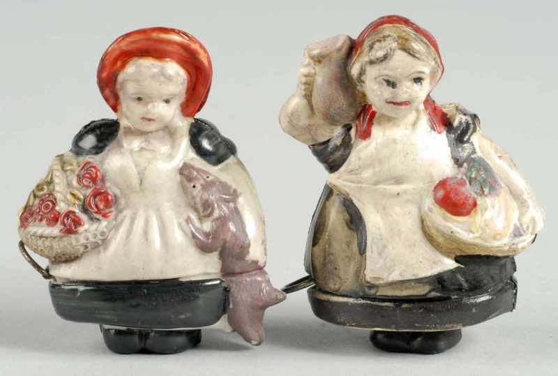 Appraisal: Lot of Girl Figural Tape Measures Description One girl accompanied