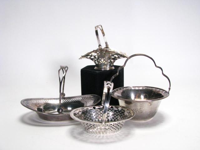 Appraisal: Group of four sterling reticulated baskets all with hinged handles