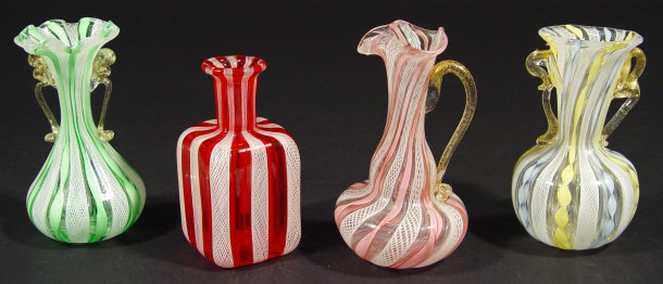 Appraisal: Four Italian glass vases with latticino and colourful striped decoration