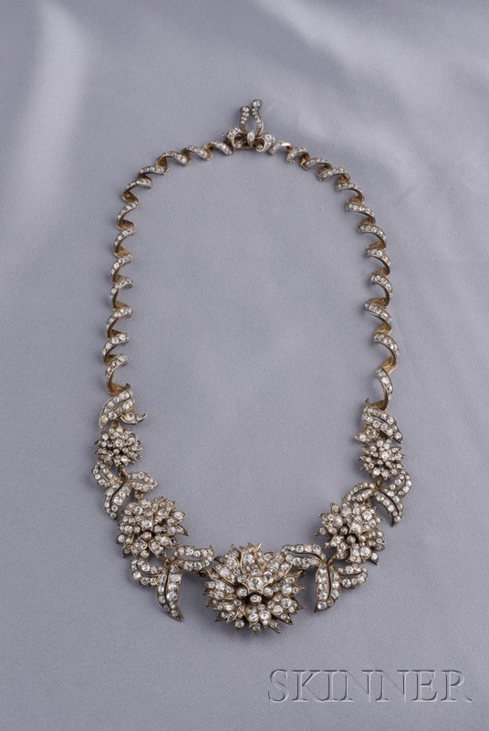 Appraisal: Diamond Necklace with flowerhead and scrolling foliate motifs completed by