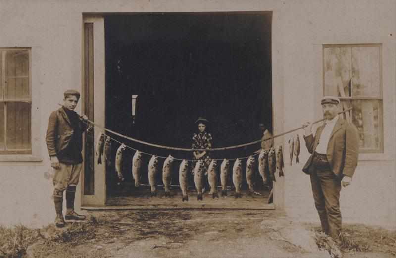 Appraisal: UNKNOWN C FISHERMEN AND THEIR CATCH Toned silver print Provenance