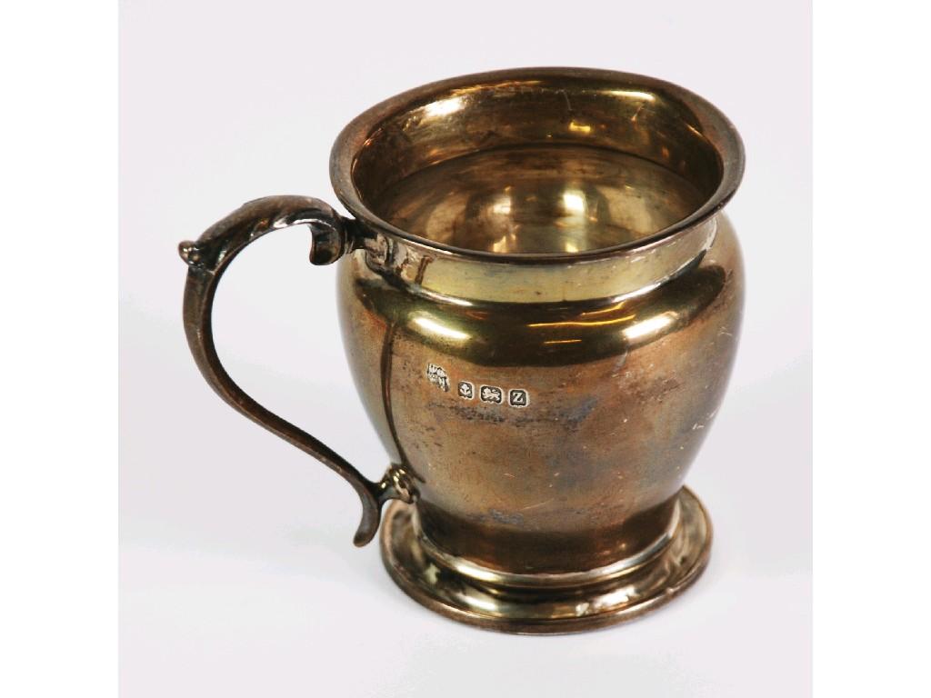 Appraisal: GEORGE V SILVER CHRISTENING MUG baluster form with scroll handle