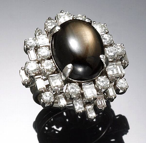 Appraisal: A black star sapphire diamond and k white gold ring