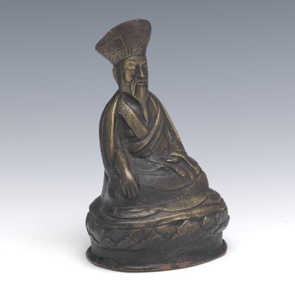 Appraisal: TIBETAN PATINATED COPPER ALLOY OF LOUHAN ON LOTUS THRONE Cast