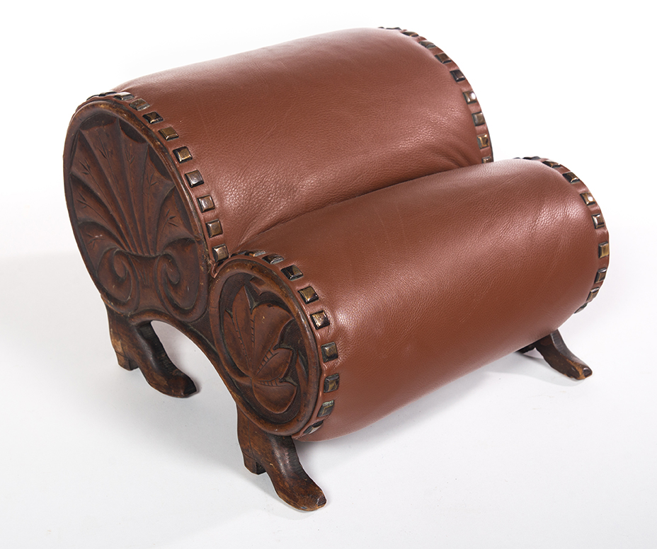 Appraisal: AMERICAN CARVED FOOTSTOOL Late th century Footstool with boot feet