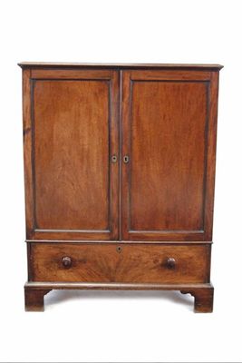 Appraisal: A small th century mahogany linen press the panelled doors