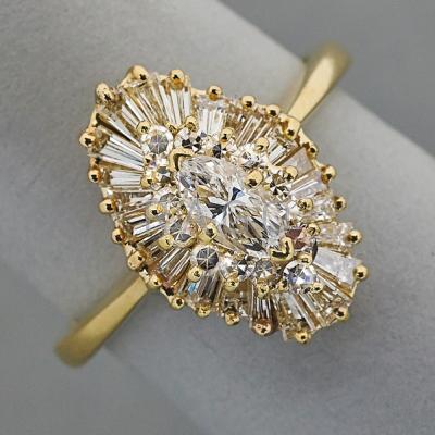 Appraisal: K GOLD MARQUISE-SHAPED DIAMOND CLUSTER RING k yg ballerina setting