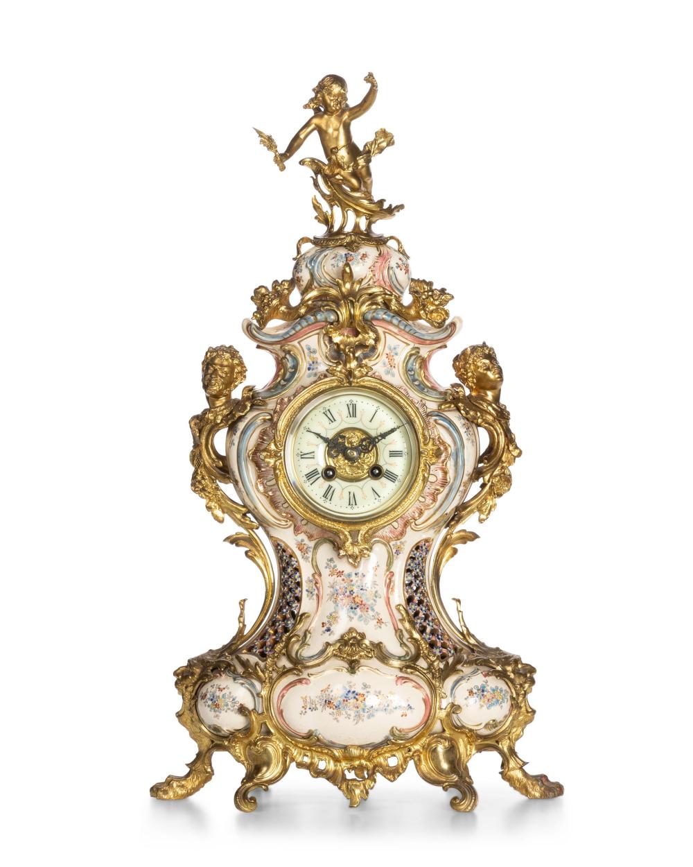 Appraisal: A Continental Rococo-style porcelain mantel clock Circa Movement marked for