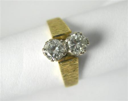 Appraisal: A 's ct gold mounted diamond two-stone ring vertically claw