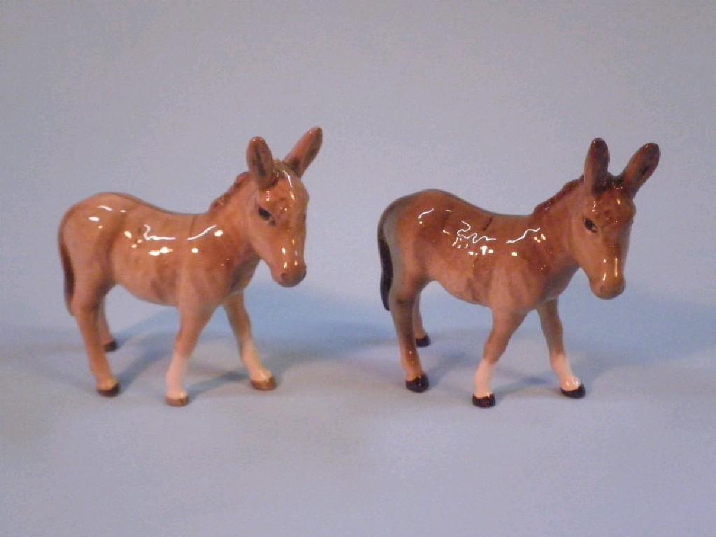 Appraisal: Beswick Two donkey foals