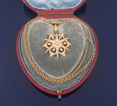 Appraisal: An Edwardian star shaped gold pendant set with diamonds and