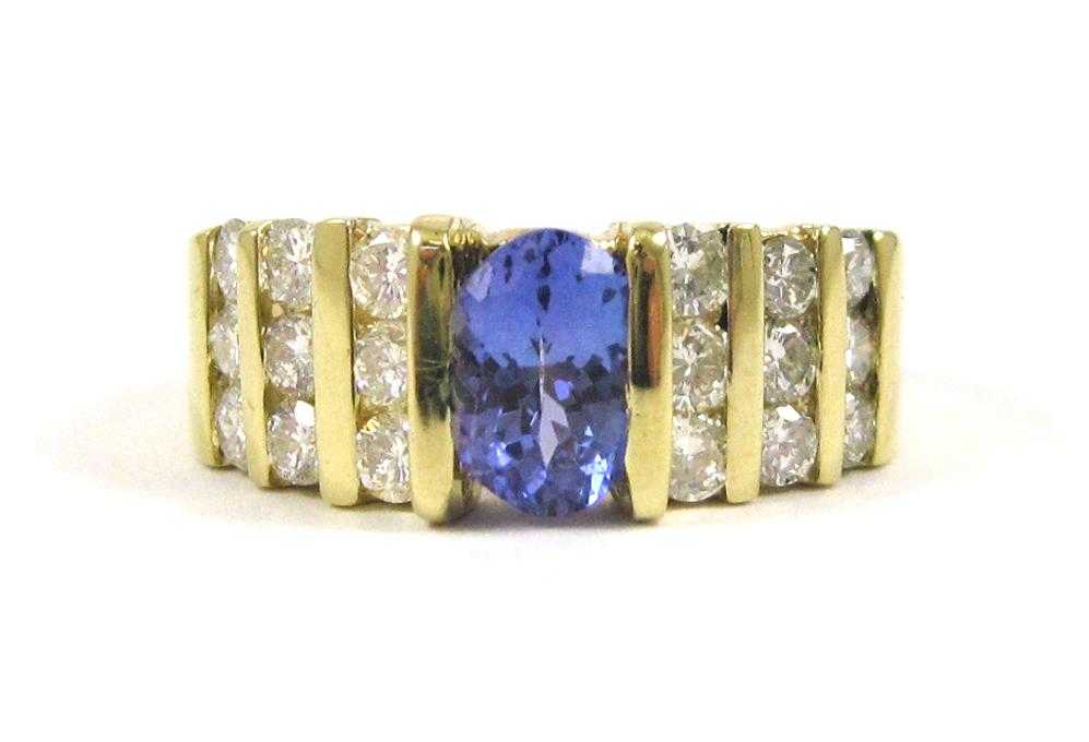 Appraisal: TANZANITE DIAMOND AND FOURTEEN KARAT GOLD RING with three rows