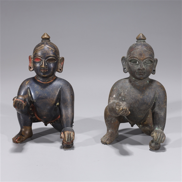 Appraisal: Two antique Indian bronze crawling Krishna statues th century or