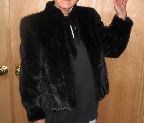 Appraisal: A LADY'S BLACK MINK FUR JACKET with collar ties pockets