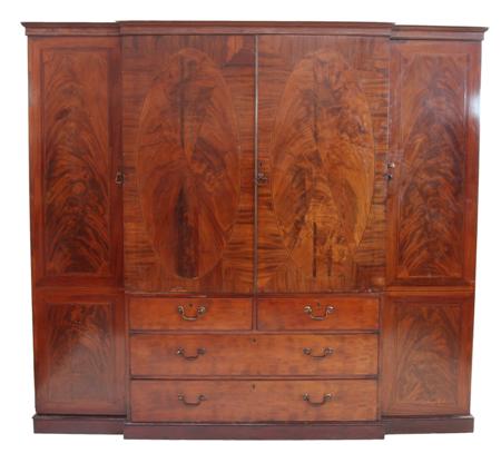 Appraisal: A George III mahogany breakfront wardrobe with boxwood and ebony