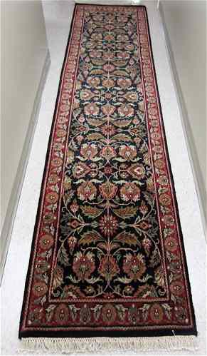 Appraisal: HAND KNOTTED ORIENTAL HALL RUG Indo-Jaipur overall floral tracery on