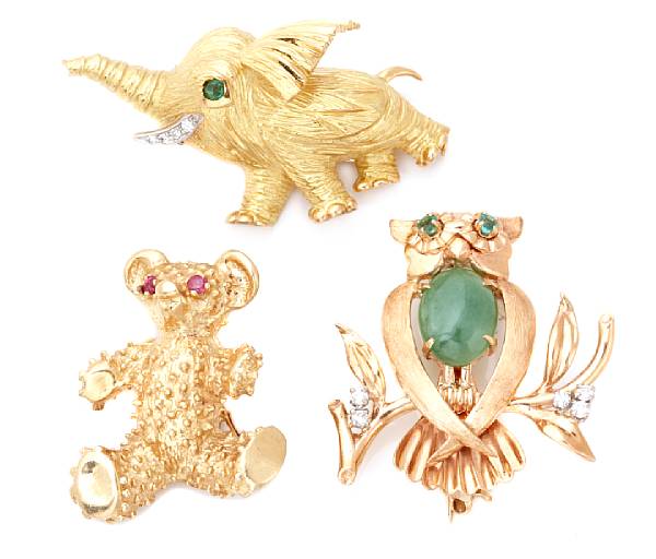 Appraisal: A group of three gem-set and gold animal brooches comprising