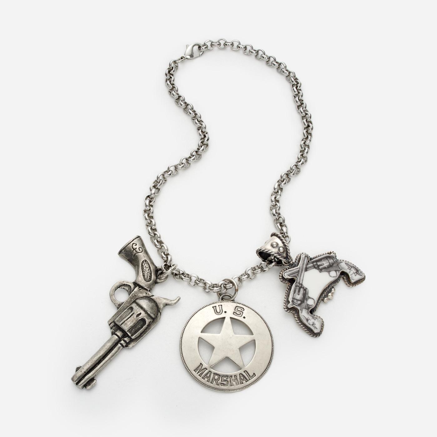 Appraisal: U S MARSHAL BADGE AND PISTOL CHARM NECKLACE A chain