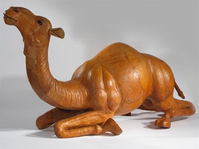 Appraisal: A leather foot stool modelled as a camel possibly retailed