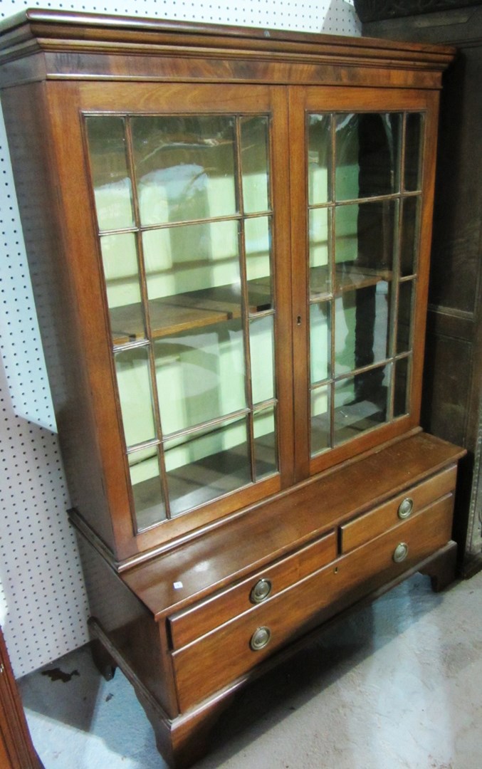 Appraisal: A th century mahogany bookcase the astragal glazed doors over