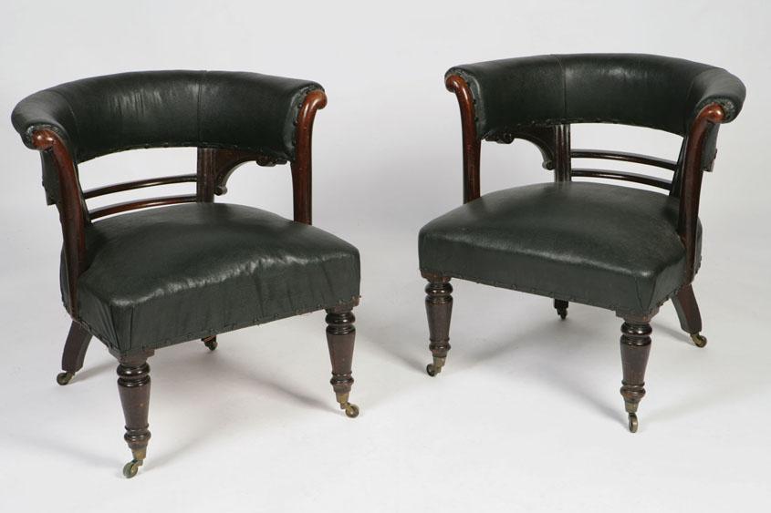 Appraisal: A PAIR OF VICTORIAN HORSESHOE SHAPED LIBRARY CHAIRS with upholstered