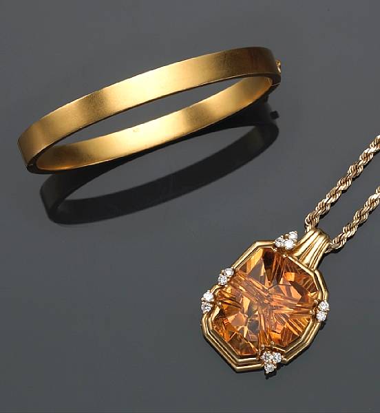 Appraisal: A citrine and diamond pendant with chain together with an