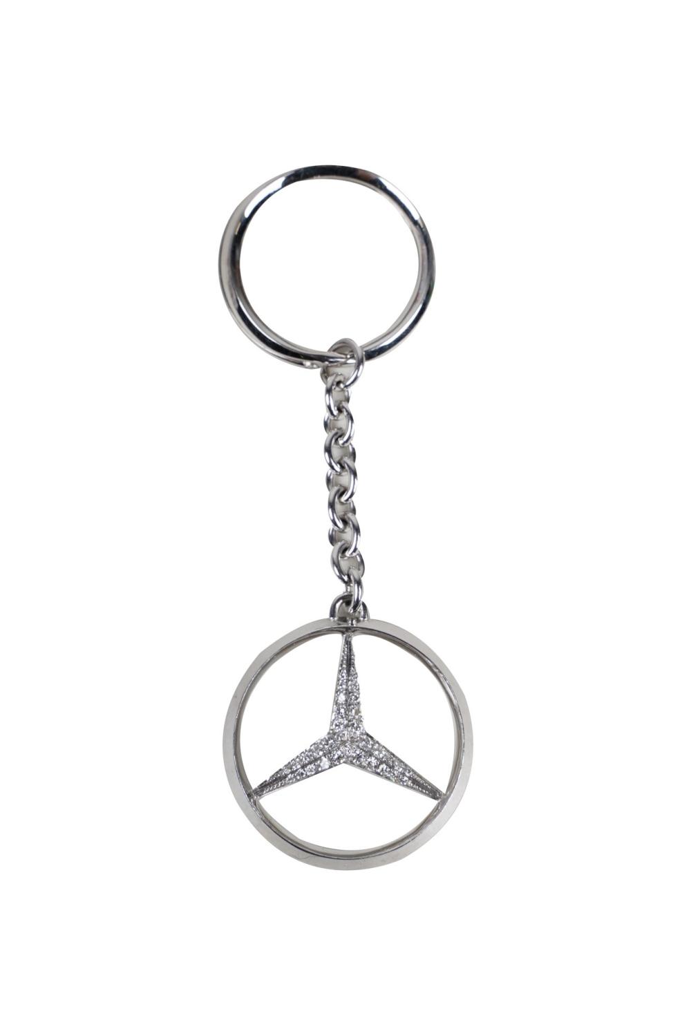 Appraisal: KARAT WHITE GOLD DIAMOND STAINLESS STEEL MERCEDES KEYCHAINcontaining full cut