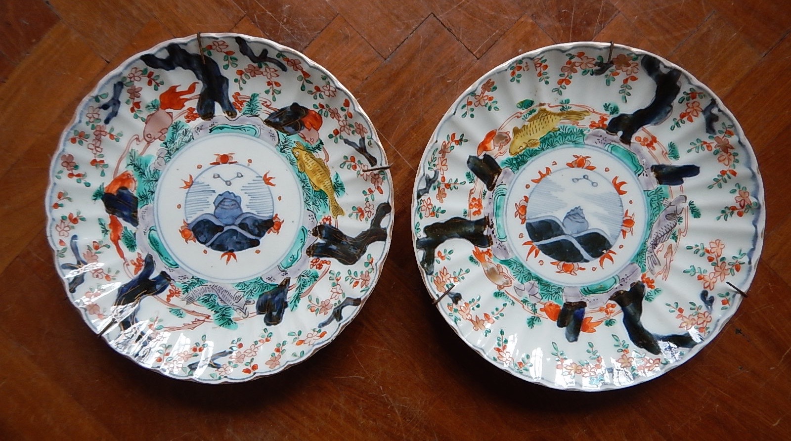 Appraisal: A pair of late thC Imari circular scalloped plates decorated