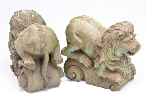 Appraisal: GARDENWARE Pair of cast-iron lions covered in green paint manufacturer