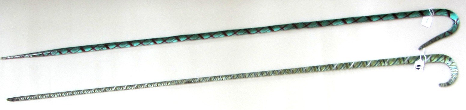 Appraisal: Two Victorian glass walking sticks with coloured spiral twist inclusions