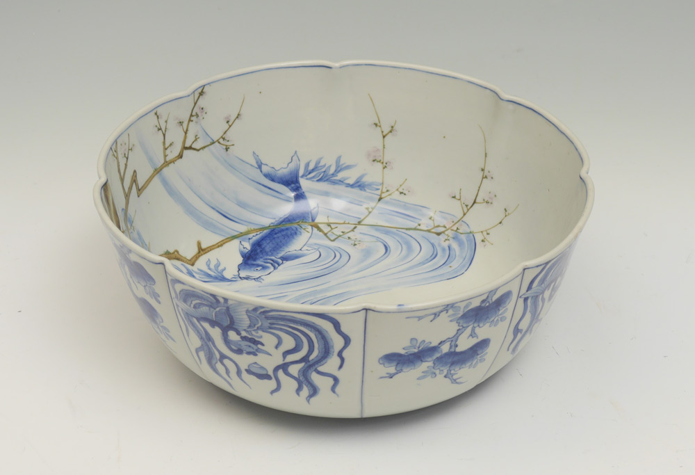 Appraisal: LARGE JAPANESE BLUE WHITE DECORATED KOI BOWL Scalloped rim interior