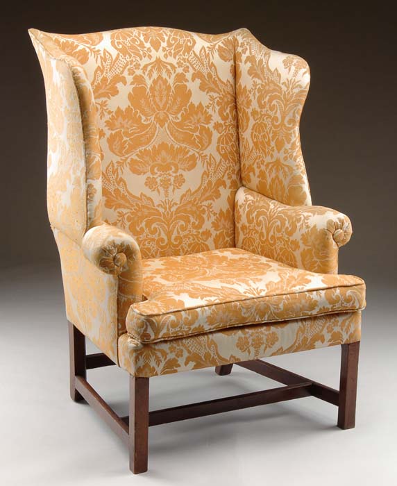 Appraisal: ANTIQUE MAHOGANY WING CHAIR Serpentine top with well formed wings