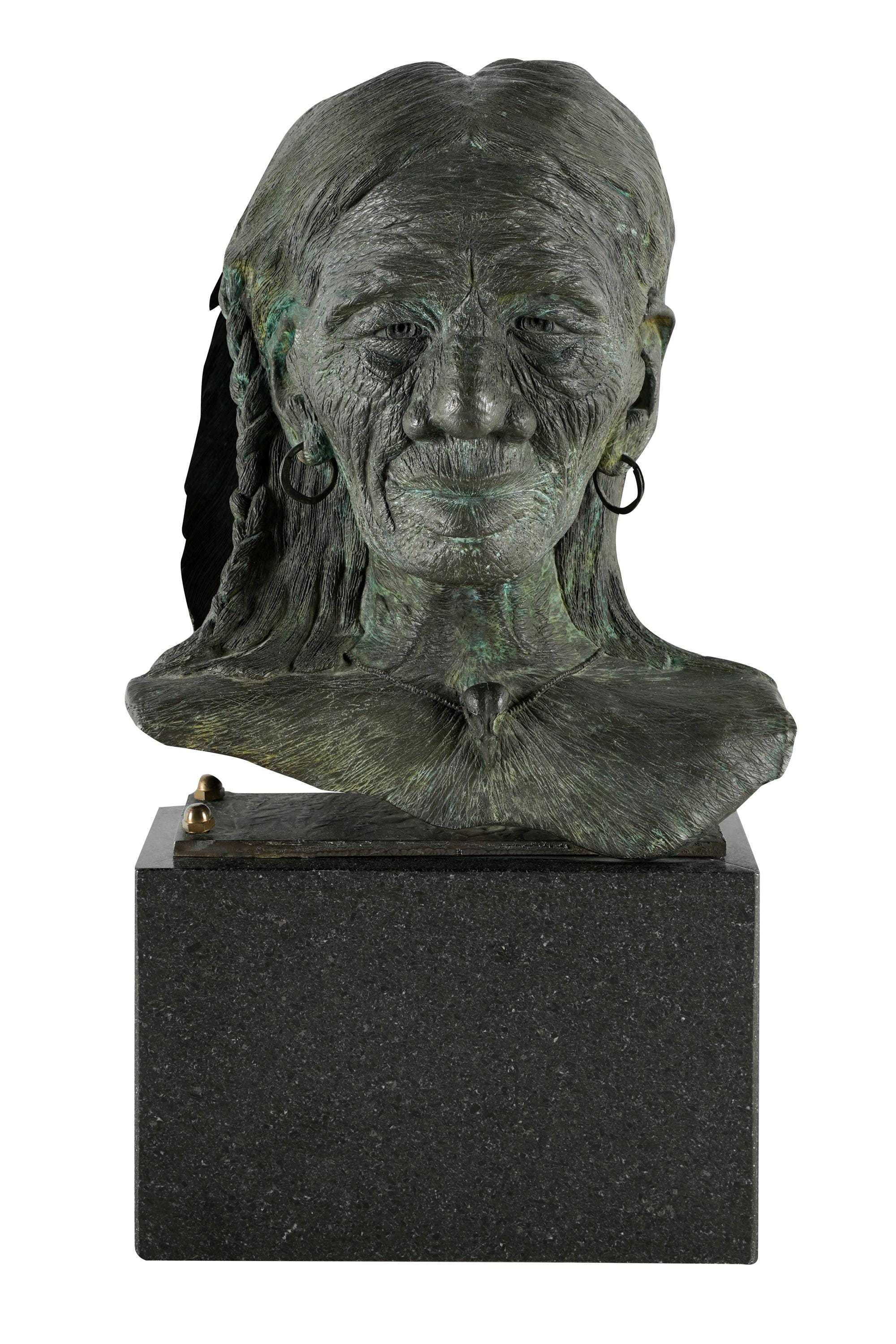 Appraisal: TH CENTURY BUST OF A NATIVE AMERICAN bronze with green