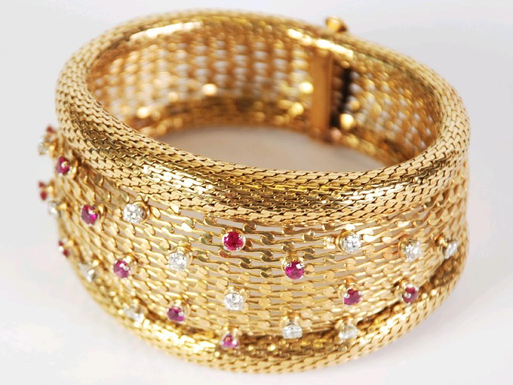 Appraisal: GOLD DIAMOND AND RUBY BROAD FLEXIBLE BRACELET zig zag link