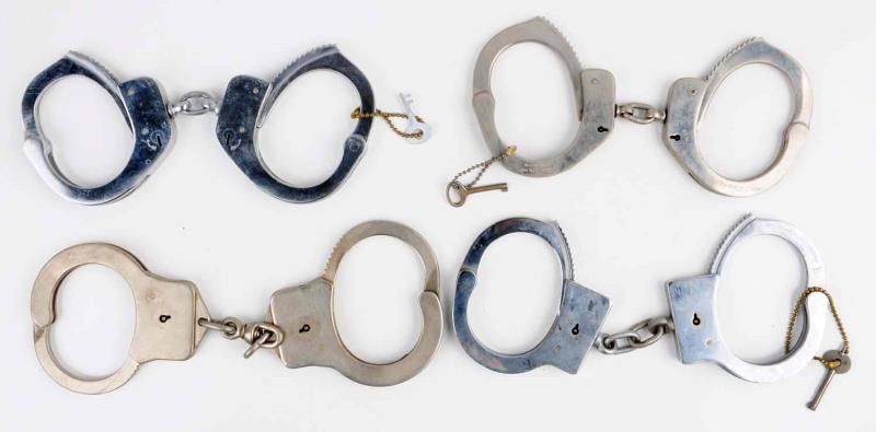 Appraisal: Lot Of Handcuffs First handcuff is Harvard Has nickel finish