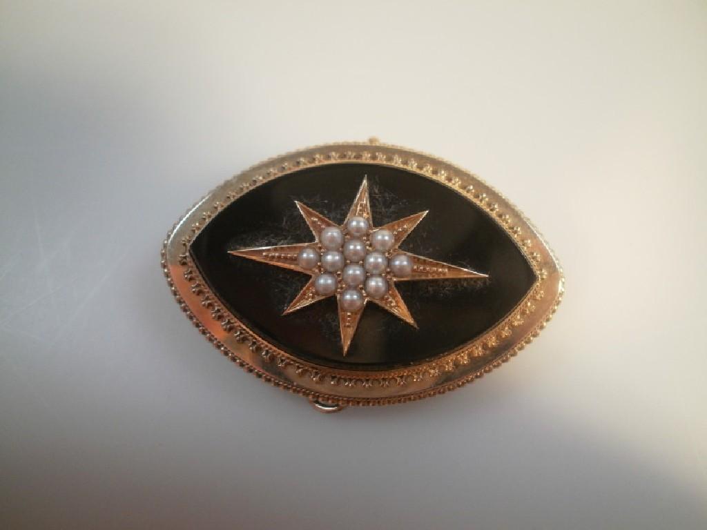 Appraisal: A Victorian memorial brooch with seed pearl set star to