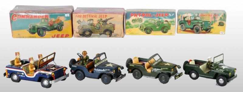 Appraisal: Lot of Tin Jeep Friction Toys Description Japanese Working Includes