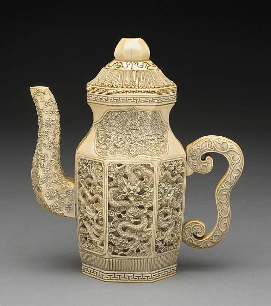 Appraisal: A tinted and pieced carved ivory teapot Of octagonal section